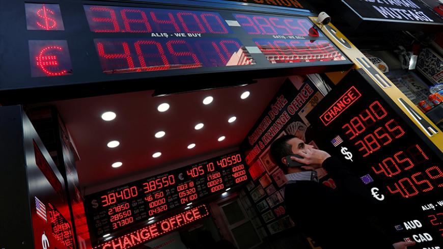 Boards showing the currency exchange rates of the U.S. dollar and the Euro against Turkish lira are on display at a currency exchange office in Istanbul, Turkey, January 11, 2017. REUTERS/Murad Sezer - RTX2YFYR