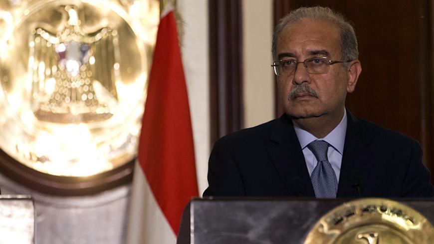 Egypt Prime Minister Sherif Ismail and his French counterpart Manuel Valls (unseen) take part in a joint press conference at the Office of the Prime Minister on October 10, 2015 in the Egyptian capital Cairo. Valls arrived in Egypt to start a three-country Arab tour aimed at boosting economic ties and for holding talks on the region's conflicts. AFP PHOTO / KENZO TRIBOUILLARD        (Photo credit should read KENZO TRIBOUILLARD/AFP/Getty Images)
