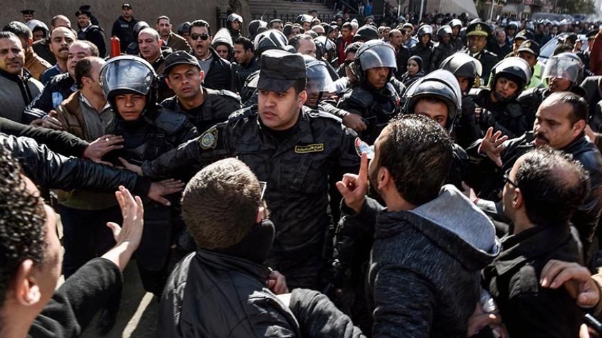 Egyptian riot policemen surround a march after the High Administrative Court upheld on January 16, 2017 a ruling voiding a government agreement to hand over two Red Sea islands to Saudi Arabia in a deal that had sparked protests in Egypt. / AFP / MOHAMED EL-SHAHED        (Photo credit should read MOHAMED EL-SHAHED/AFP/Getty Images)