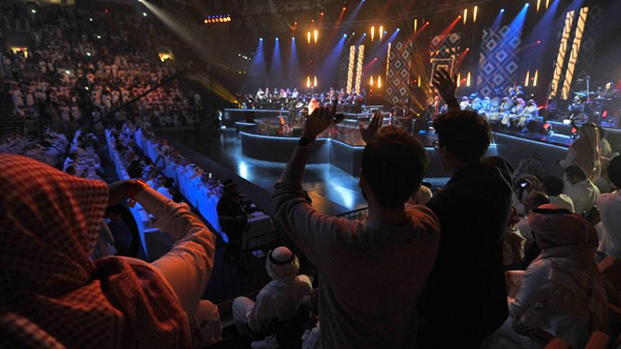 CORRECTION - Saudis attend a concert in Jeddah on January 30, 2017.
Saudi Arabia's "Paul McCartney" took to the stage as the kingdom seeks to boost entertainment despite religious warnings of "depravity." The performance was the first major concert in seven years in the kingdom's second city, according to Arab News.
 / AFP / Amer HILABI / The erroneous mention[s] appearing in the metadata of this photo by AMER HILABI has been modified in AFP systems in the following manner: [AMER HILABI] instead of [AMEER A