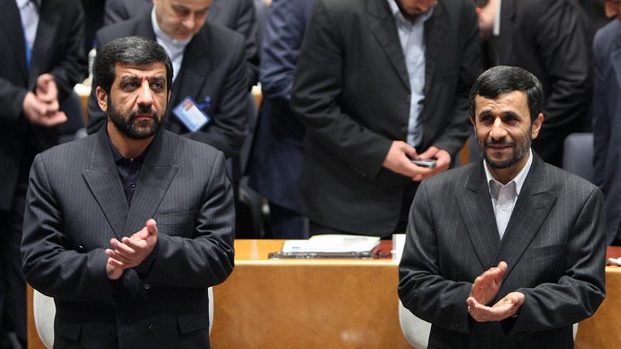 Iranian President Mahmoud Ahmadinejad (R) and head of Iran TV, Ezzatollah Zarghami, (L) applaud as they attend the 44th General assembly of the Asia-Pacific Broadcaasting Union in Tehran 03 November 2007. AFP PHOTO/ATTA KENARE (Photo credit should read ATTA KENARE/AFP/Getty Images)
