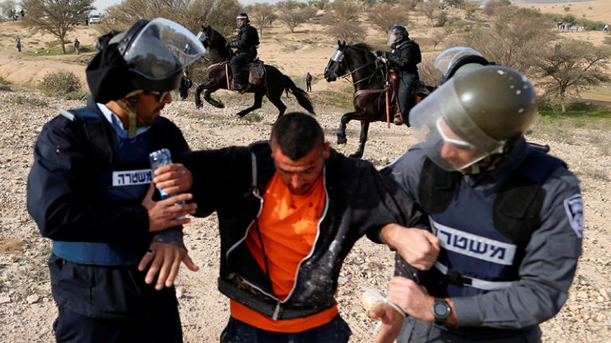 REFILE - UPDATING SLUGArab Israelis clash with Israeli riot policemen in Umm Al-Hiran, a Bedouin village in Israel's southern Negev Desert January 18, 2017. REUTERS/Ammar Awad - RTSW0X6