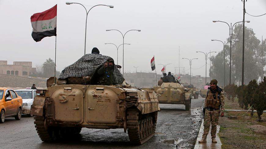 Iraqi army tanks are seen in Mosul, Iraq, January 28, 2017. REUTERS/Azad Lashkari - RTSXRKU