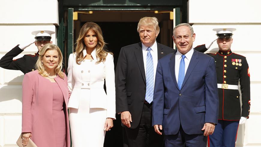 U.S. President Donald Trump (2ndR) and first lady Melania Trump greet Israeli Prime Minister Benjamin Netanyahu and his wife Sara (L) as they arrive at the South Portico of the White House in Washington, U.S., February 15, 2017. REUTERS/Kevin Lamarque - RTSYTO4