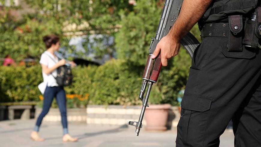 A riot police stands guard during a pro-Kurdish gathering in the southeastern city of Diyarbakir, Turkey, August 31, 2016. To match TURKEY-SECURITY/POLICE   REUTERS/Sertac Kayar - RTX2OUGW