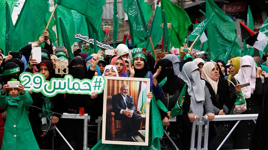 Palestinian Hamas supporters shout slogans during a rally marking the 29th anniversary of the founding of the Hamas movement, in Gaza city December 14, 2016. REUTERS/Suhaib Salem - RTX2UZFP