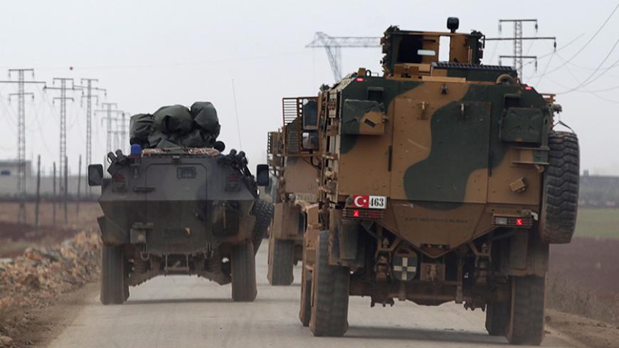 Turkish military vehicles drive in the Syrian rebel-held town of al-Rai, as they head towards the northern Syrian town of al-Bab, Syria January 4, 2017. REUTERS/Khalil Ashawi - RTX2XITU