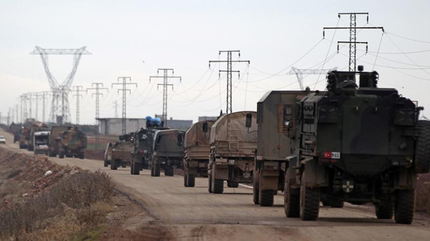 Turkish military vehicles drive in the Syrian rebel-held town of al-Rai, as they head towards the northern Syrian town of al-Bab, Syria January 9, 2017. REUTERS/Khalil Ashawi - RTX2Y60D
