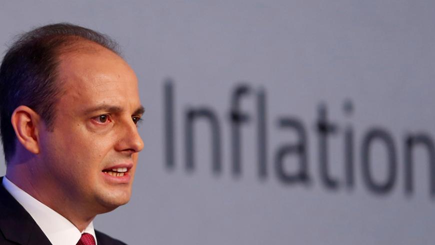 FILE PHOTO: Turkey's central bank governor Murat Cetinkaya speaks during a news conference in Istanbul, Turkey October 27, 2016. REUTERS/Murad Sezer/File Photo - RTX2YZ4Q