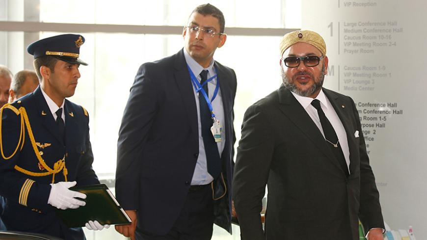 King Mohammed VI of Morocco (R) is escorted as he arrives at the 28th Ordinary Session of the Assembly of the Heads of State and the Government of the African Union in Ethiopia's capital Addis Ababa, January 31, 2017. REUTERS/Tiksa Negeri - RTX2YZKL