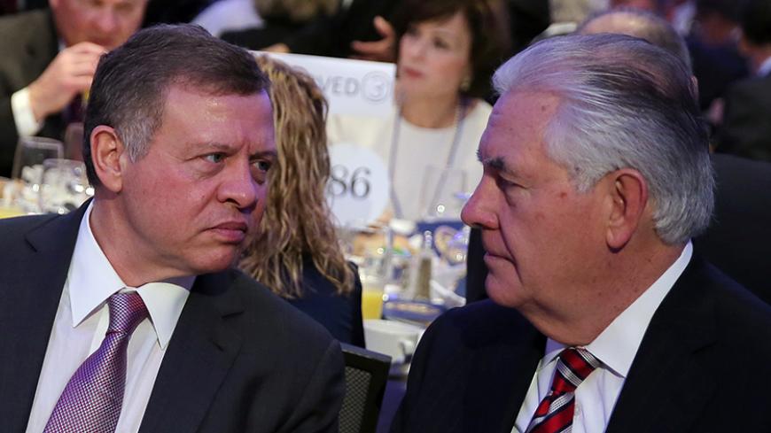 Jordan's King Abdullah (L) speaks with Secretary of State Rex Tillerson at the National Prayer Breakfast in Washington, U.S., February 2, 2017. REUTERS/Carlos Barria - RTX2ZCD3