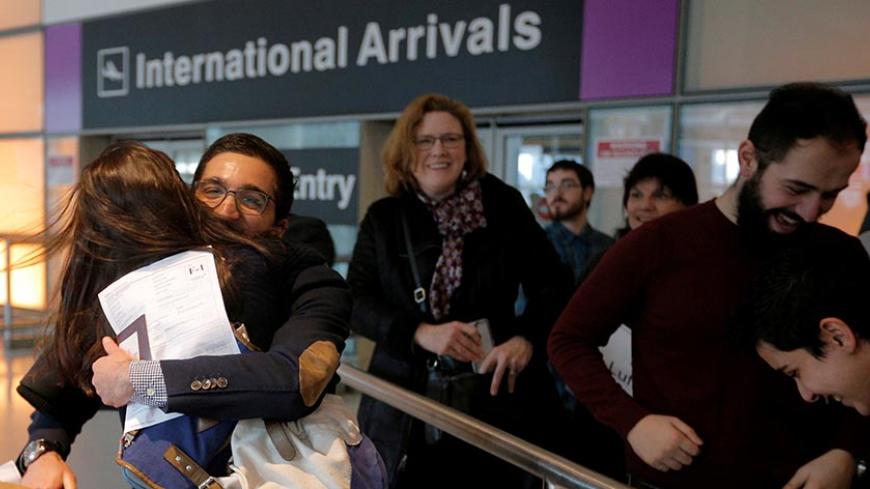 Behnam Partopour, a Worcester Polytechnic Institute (WPI) student from Iran, is greeted by his sister Bahar (L) at Logan Airport after he cleared U.S. customs and immigration on an F1 student visa in Boston, Massachusetts, U.S. February 3, 2017. Partopour was originally turned away from a flight to the U.S. following U.S. President Donald Trump's executive order travel ban. REUTERS/Brian Snyder TPX IMAGES OF THE DAY - RTX2ZKDO
