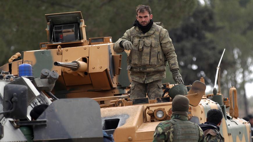 Turkish forces and members of the Free Syrian Army are seen at the al Baza'a village on the outskirts of al-Bab town in Syria February 4, 2017. Picture Taken February 4, 2017. REUTERS/Khalil Ashawi - RTX2ZOPF