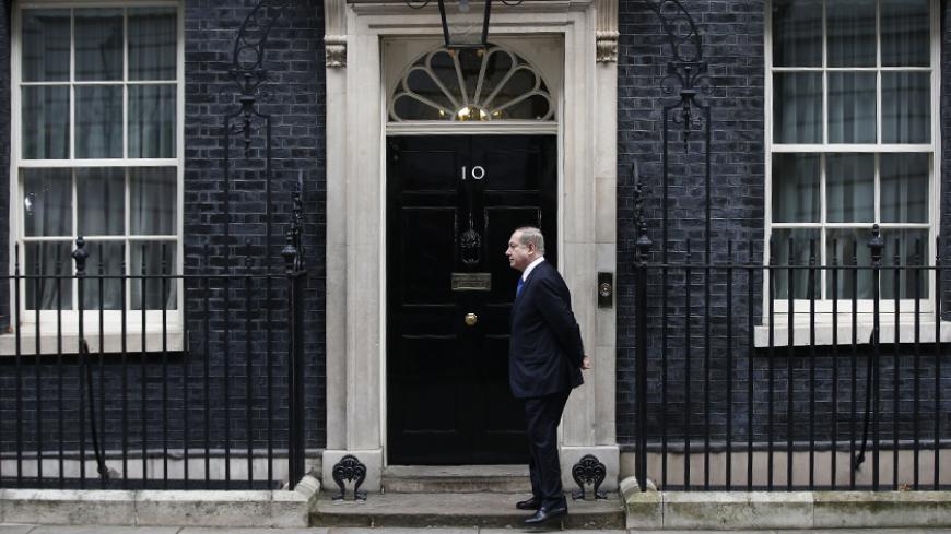 Israel's Prime Minister Benjamin Netanyahu stands alone on the doorstep of 10 Downing Street as he arrives to visit Britain's Prime Minister Theresa May in London, February 6, 2017. REUTERS/Peter Nicholls - RTX2ZTWJ
