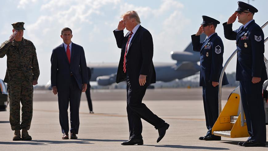 U.S. President Donald Trump  salutes as he arrives at MacDill Air Force Base in Tampa, Florida, U.S., February 6, 2017. REUTERS/Carlos Barria - RTX2ZVRM