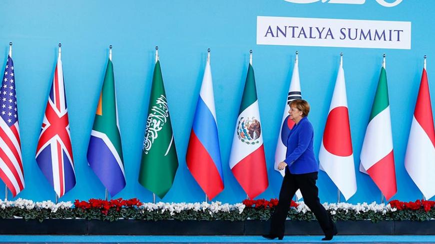 FILE PHOTO: German Chancellor Angela Merkel arrives for a welcoming ceremony during the Group of 20 (G20) leaders summit in the Mediterranean resort city of Antalya, Turkey, November 15, 2015.  REUTERS/Murad Sezer/File Photo - RTX30909
