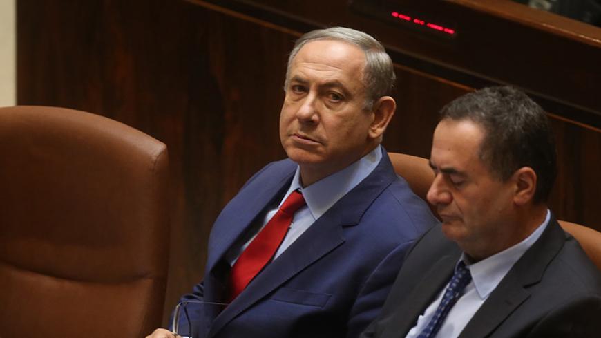 Israeli Prime Minister Benjamin Netanyahu (L) sits next to Minister of Transport Yisrael Katz during the opening of the winter session at the Israeli parliament in Jerusalem on October 31, 2016. / AFP / MENAHEM KAHANA        (Photo credit should read MENAHEM KAHANA/AFP/Getty Images)