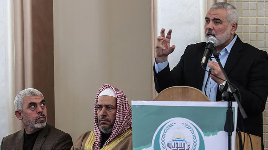 Yahya Sinwar (L) the new leader of Hamas in the Gaza Strip and senior political leaders of the Islamist movement Khalil al-Haya (C) Ismail Haniyeh (R) attend the opening of a new mosque in Rafah town in the southern Gaza Strip on February 24, 2017. / AFP / SAID KHATIB (Photo credit should read SAID KHATIB/AFP/Getty Images)