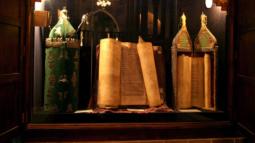 Torah scrolls are exhibited at the Babylonian Jewry Heritage Center in Or Yehuda, near Tel Aviv, in this October 19, 2006 picture. World Jewish groups began a global campaign on Sunday calling for recognition of Jews from Arab countries as refugees in the Middle East conflict. REUTERS/Gil Cohen Magen (ISRAEL) - RTR1IKQX
