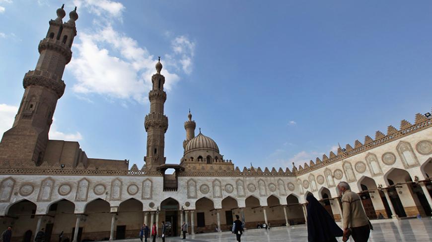 Muslim walk at Al Azhar mosque in the old city of Cairo December 2, 2011. The Muslim Brotherhood's party and its ultra-conservative Salafi rivals looked set to top the polls in Egypt's election, to the alarm of many at home and abroad. Moderate Islamists have won elections in Tunisia and Morocco in the past two months. REUTERS/Amr Abdallah Dalsh  (EGYPT - Tags: POLITICS ELECTIONS RELIGION) - RTR2UROC