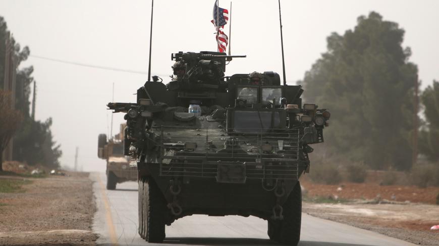 American army vehicles drive north of Manbij city, in Aleppo Governorate, Syria March 9, 2017. REUTERS/Rodi Said - RTS126K2