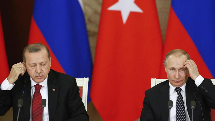 Russian President Vladimir Putin (R) and his Turkish counterpart Tayyip Erdogan attend a news conference after the talks at the Kremlin in Moscow, Russia, March 10, 2017. REUTERS/Sergei Ilnitsky/Pool - RTS12BYZ