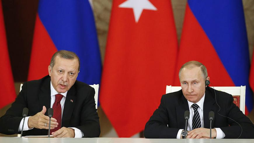 Russian President Vladimir Putin (R) and his Turkish counterpart Tayyip Erdogan attend a news conference after the talks at the Kremlin in Moscow, Russia, March 10, 2017. REUTERS/Sergei Ilnitsky/Pool - RTS12BZC