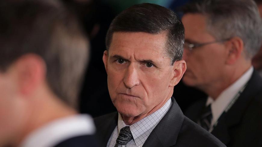 White House National Security Advisor Michael Flynn (C) arrives prior to a joint news conference between Canadian Prime Minister Justin Trudeau and U.S. President Donald Trump at the White House in Washington, U.S., February 13, 2017. REUTERS/Carlos Barria - RTSYJDE