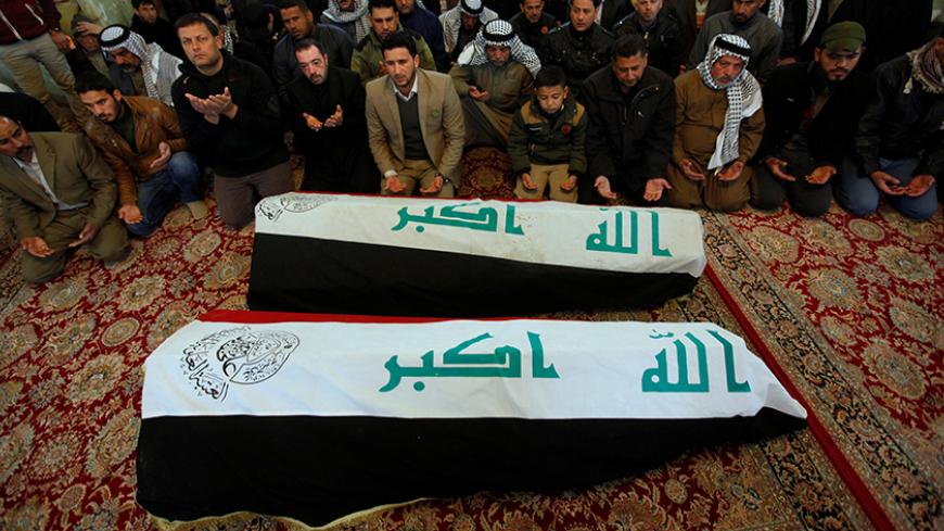 Mourners pray during a funeral for victims who were killed when a car packed with explosives blew up on Thursday, in Hayy al-Shurta, a Shi'ite district in Baghdad, in Najaf, Iraq February 17, 2017. REUTERS / Alaa Al-Marjani TPX IMAGES OF THE DAY     TPX IMAGES OF THE DAY - RTSZ4T9