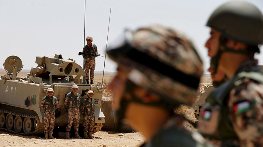 Soldiers stand guard at the Jordanian-Syrian border, near Mafraq, August 16, 2015. Commander of the Jordanian Border Guard, Brigadier General Saber Mahayrah said on Sunday that there was no sign of Nusra Front or Islamist State fighters on the border between Jordan and Syria. REUTERS/Muhammad Hamed - RTX1OEMO