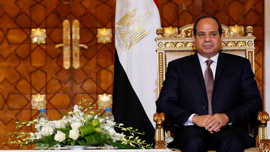 Egypt's President Abdel Fattah al-Sisi attends during signing of agreements ceremony with Sudanese President Omar Hassan al-Bashir (unseen) at the El-Thadiya presidential palace in Cairo, Egypt October 5, 2016. Picture taken October 5, 2016. REUTERS/Amr Abdallah Dalsh - RTX2Q29F