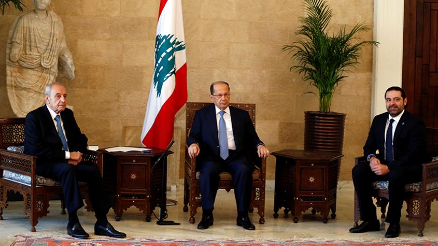 Newly elected Lebanese president Michel Aoun (C) sits with former prime minister Saad al-Hariri (R), who is expected to lead the new Lebanese government, and Parliament Speaker Nabih Berri (L) at the presidential palace in Baabda, near Beirut, Lebanon November 3, 2016. REUTERS/Mohamed Azakir - RTX2ROR8