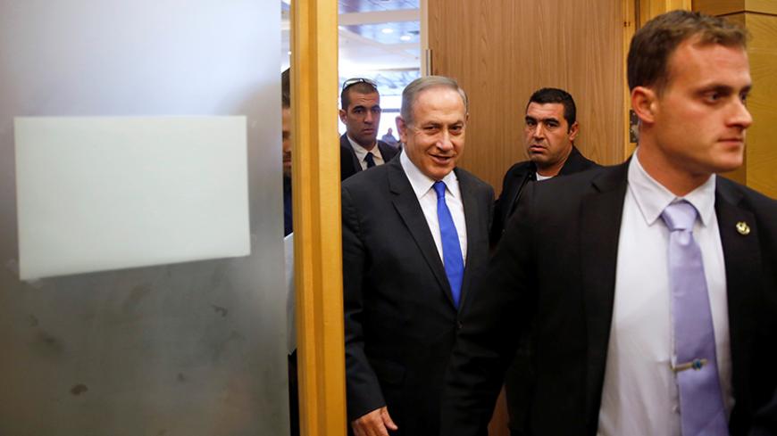 Israeli Prime Minister Benjamin Netanyahu arrives to attend a Likud party meeting at the Knesset, the Israeli parliament, in Jerusalem January 2, 2017. REUTERS/Ronen Zvulun - RTX2X8FC