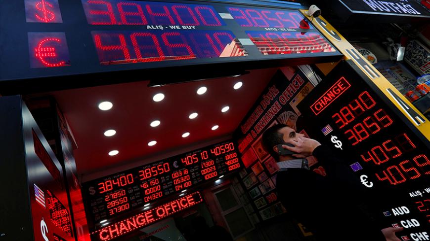 Boards showing the currency exchange rates of the U.S. dollar and the Euro against Turkish lira are on display at a currency exchange office in Istanbul, Turkey, January 11, 2017. REUTERS/Murad Sezer - RTX2YFYR