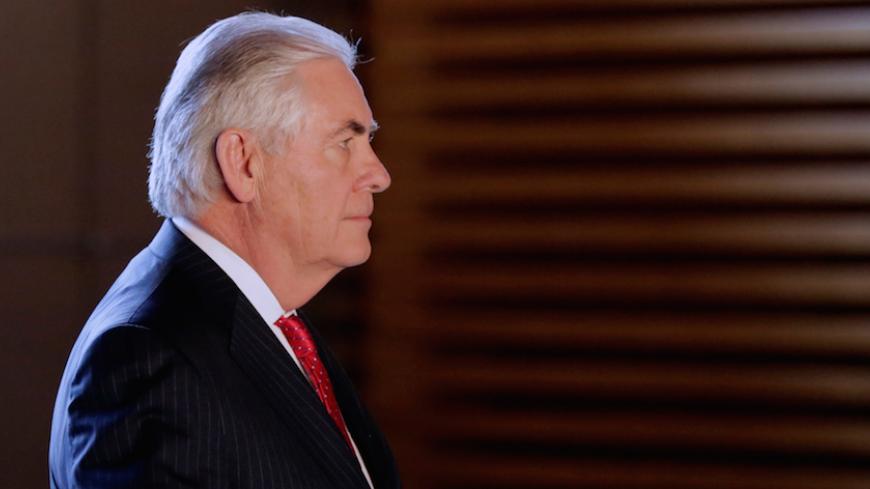U.S. Secretary of State Rex Tillerson walks to meet Japanese Prime Minister Shinzo Abe, prior to their meeting at the prime minister's office in Tokyo, Japan March 16, 2017. REUTERS/Eugene Hoshiko/Pool - RTX318XX