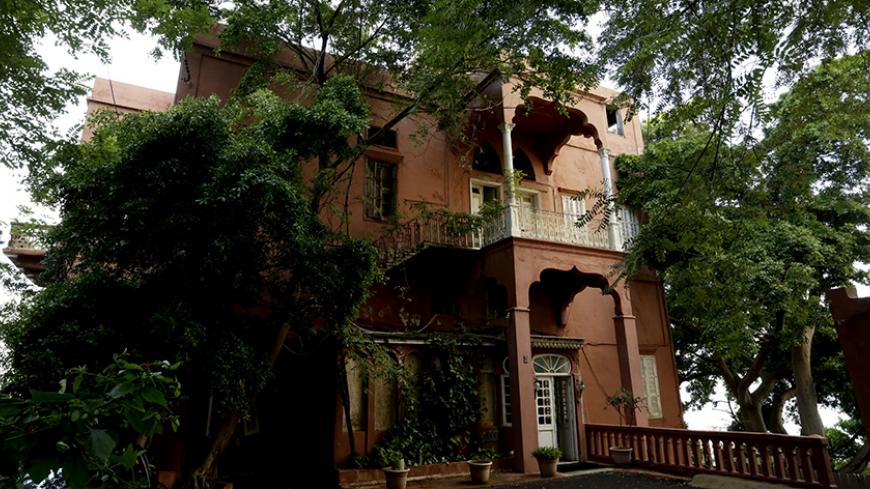 TO GO WITH AFP STORY BY RANA MOUSSAOUI
A picture taken on November 24, 2014 shows Ras Beirut's landmark Rose House, an Ottoman villa overlooking the Mediterranean in the heart of the Lebanese capital, that is a lonely reminder of Beirut's romantic past.  A rare survivor not just of the 15-year civil war that claimed so many of its historic mansions, but the building boom that came with peace from 1990, it is even said to haunt some of the Beirutis' dreams as a symbol of the lightness and beauty their city s