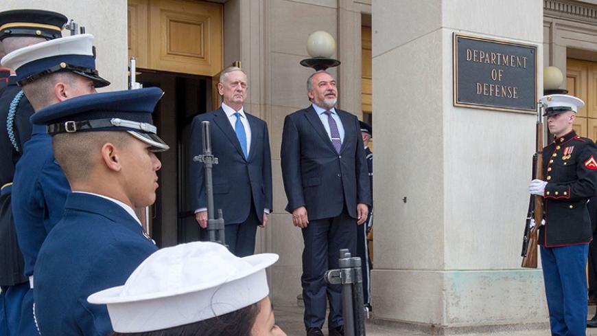 US Secretary of Defense James Mattis(L) stands with Israel's Minister of Defense Avigdor Lieberman with an Honor Guard, listening to their respective national anthems upon arrival to the Pentagon on March 7, 2017 in Washington, DC. / AFP PHOTO / PAUL J. RICHARDS (Photo credit should read PAUL J. RICHARDS/AFP/Getty Images)