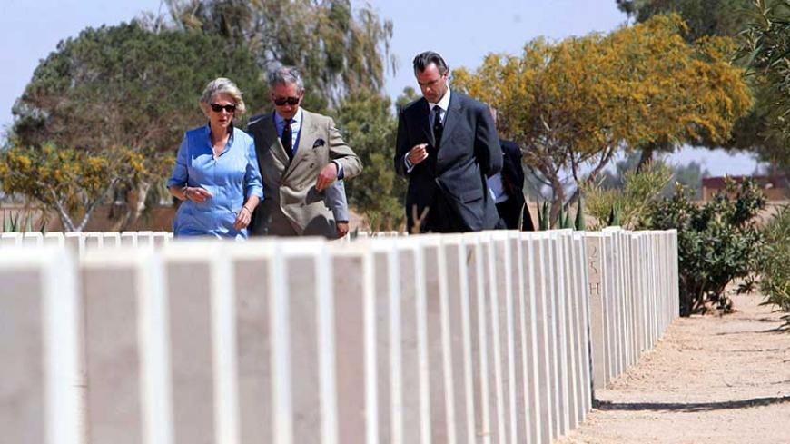 Britain's Prince Charles and his wife Camilla, the Duchess of Cornwall, visit the el-Alamein war cemetery, northwest of Egypt March 24, 2006. The royals visited the cemetery to honour Commonwealth servicemen who lost their lives during a pivotal battle of the Second World War. REUTERS/Khaled Desouki/Pool - RTR17L27