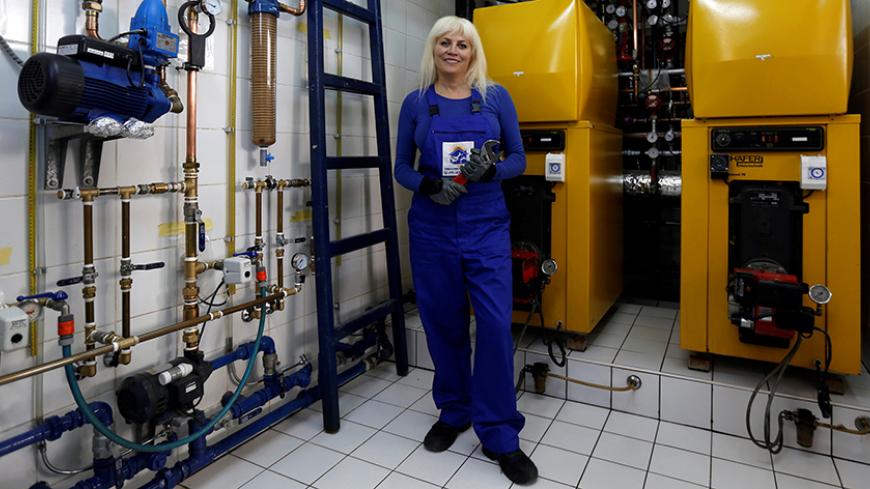 Khawla Sheikh, 54, a plumber and a certified trainer, poses at her home's basement, where she gives plumbing training courses to other women, in Amman, Jordan, February 23, 2017. "Housewives are more comfortable to have a woman plumber in their house in the absence of their husbands," said Sheikh. "To tackle gender inequality, I think that all operating sectors must provide equal opportunities for men and women in all fields and each woman must believe in her capabilities and skills that she has in order to