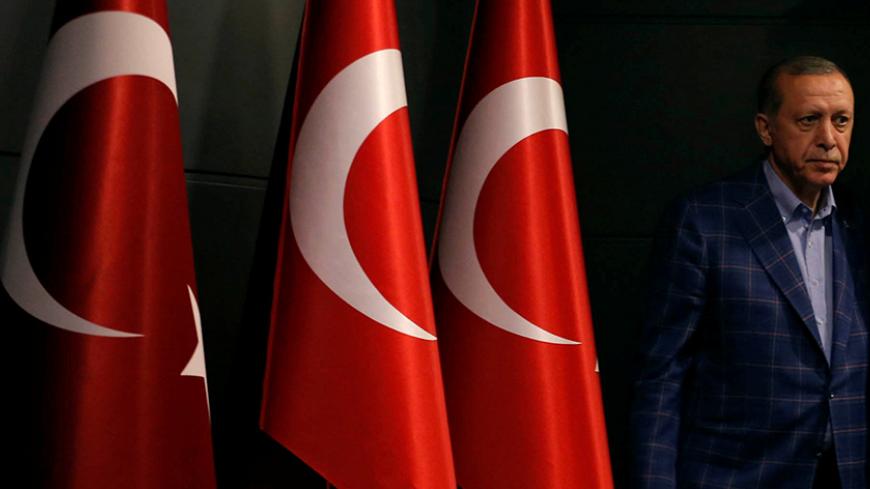 Turkish President Recep Tayyip Erdogan arrives at a news conference in Istanbul, Turkey April 16, 2017. Picture taken April 16, 2017. REUTERS/Murad Sezer - RTS12L9W