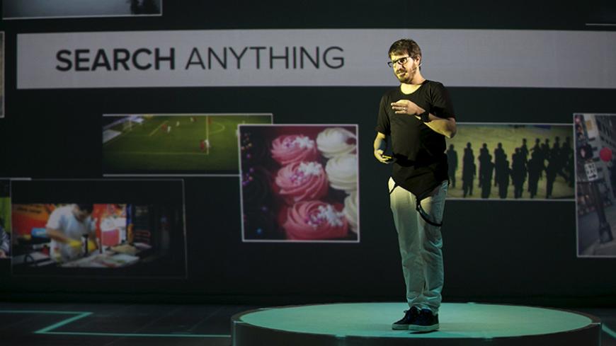 Moshe Hogeg, Chief Executive of Mobli Media Inc, an Israeli start-up, speaks during the company's launch in Tel Aviv, Israel June 15, 2015. Israeli start-up Mobli Media Inc is taking on Internet giants Google, Facebook and Yahoo with an innovative online search tool to find the latest photos and videos across social media sites, the company said on Monday. REUTERS/Baz Ratner  - RTX1GM8C