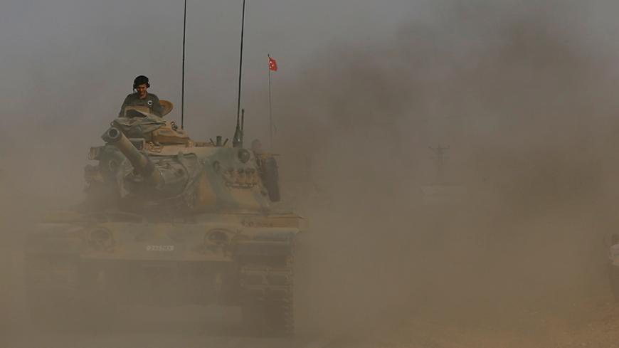 A Turkish army tank drives towards to the border in Karkamis on the Turkish-Syrian border in the southeastern Gaziantep province, Turkey, August 25, 2016. REUTERS/Umit Bektas - RTX2MYVY