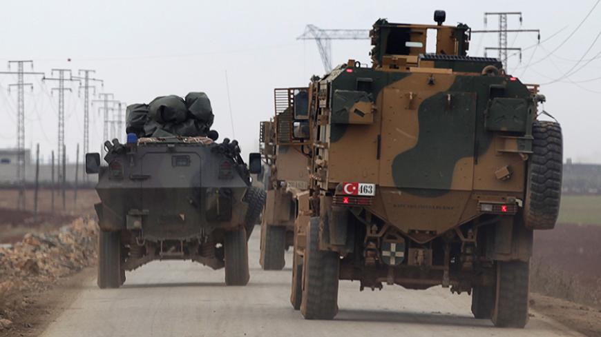 Turkish military vehicles drive in the Syrian rebel-held town of al-Rai, as they head towards the northern Syrian town of al-Bab, Syria January 4, 2017. REUTERS/Khalil Ashawi - RTX2XITU