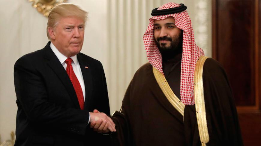 U.S. President Donald Trump and Saudi Deputy Crown Prince and Minister of Defense Mohammed bin Salman meet at the White House  in Washington, U.S., March 14, 2017. REUTERS/Kevin Lamarque - RTX30ZV3