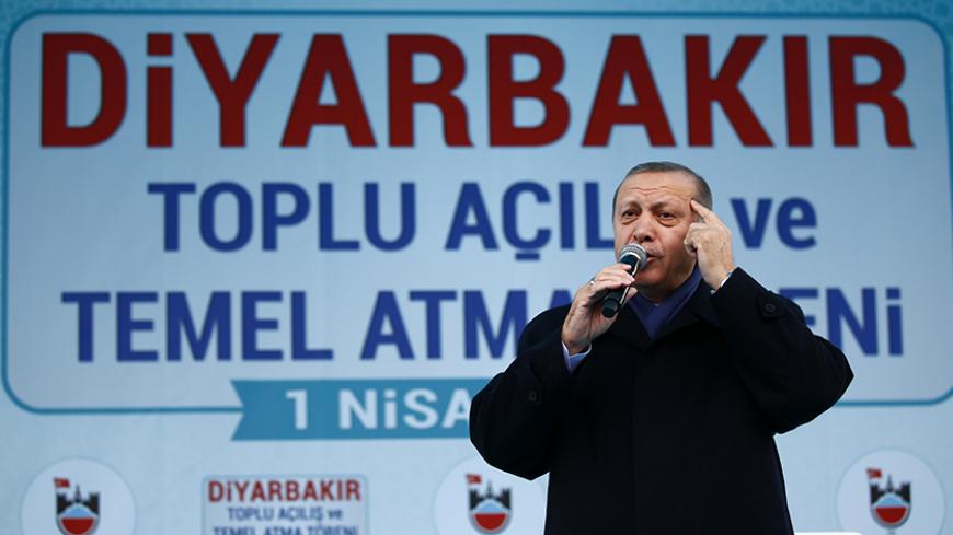 Turkish President Tayyip Erdogan addresses his supporters during a rally for the upcoming referendum in the Kurdish-dominated southeastern city of Diyarbakir, Turkey, April 1, 2017. REUTERS/Murad Sezer - RTX33N12