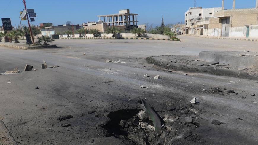A crater is seen at the site of an airstrike, after what rescue workers described as a suspected gas attack in the town of Khan Sheikhoun in rebel-held Idlib, Syria April 4, 2017. REUTERS/Ammar Abdullah     TPX IMAGES OF THE DAY - RTX33ZDA