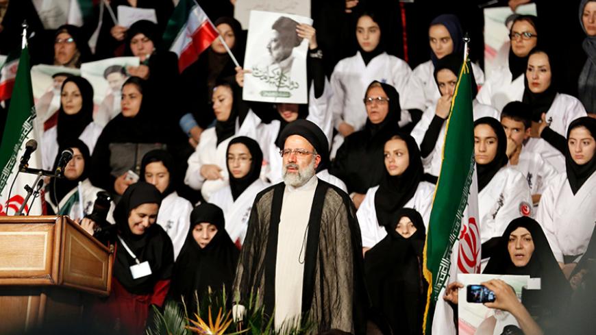 Iranian presidential candidate Ebrahim Raisi looks on during a campaign rally in the capital Tehran on April 29, 2017. / AFP PHOTO / ATTA KENARE        (Photo credit should read ATTA KENARE/AFP/Getty Images)