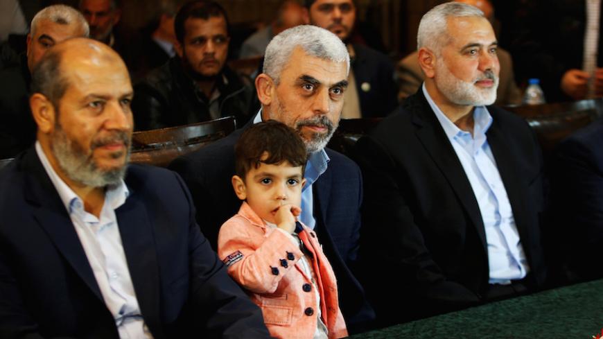 Hamas leader Ismail Haniyeh (R) and Hamas Gaza Chief Yehya Al-Sinwar attend a ceremony announcing a new policy document, in Gaza City May 1, 2017. REUTERS/Mohammed Salem - RTS14OXC