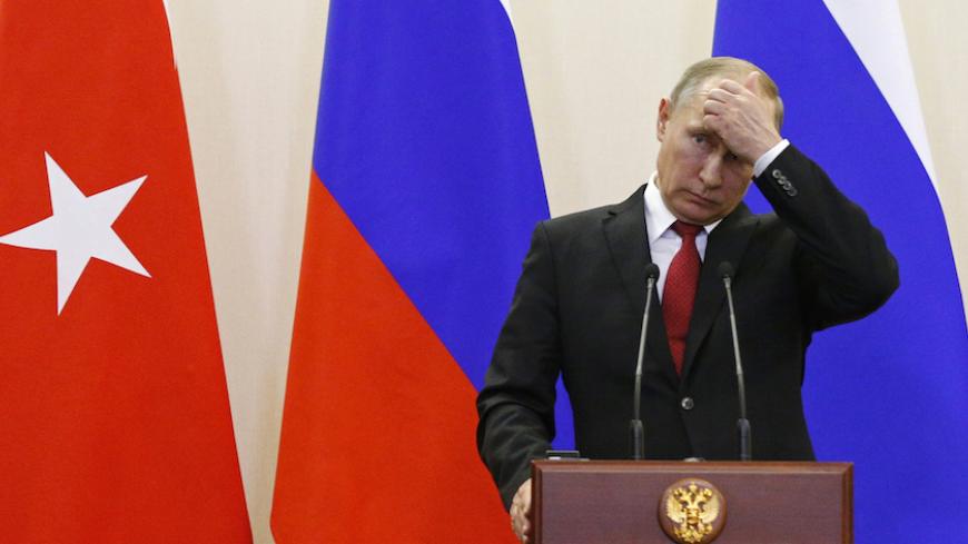 Russian President Vladimir Putin attends a news conference following the talks with his Turkish counterpart Tayyip Erdogan in Sochi, Russia, May 3, 2017. REUTERS/Alexander Zemlianichenko/Pool - RTS14ZO6