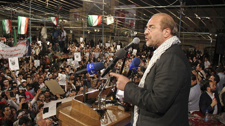 Tehran Mayor and Iranian presidential candidate Mohammad Baqer Qalibaf speaks at a campaign rally in Khomeinishahr in central Iran June 10, 2013. The Iranian presidential election will be held on June 14. Picture taken June 10, 2013.  REUTERS/Fars News (IRAN - Tags: POLITICS ELECTIONS) ATTENTION EDITORS - THIS IMAGE WAS PROVIDED BY A THIRD PARTY. FOR EDITORIAL USE ONLY. NOT FOR SALE FOR MARKETING OR ADVERTISING CAMPAIGNS. THIS PICTURE IS DISTRIBUTED EXACTLY AS RECEIVED BY REUTERS, AS A SERVICE TO CLIENTS - 